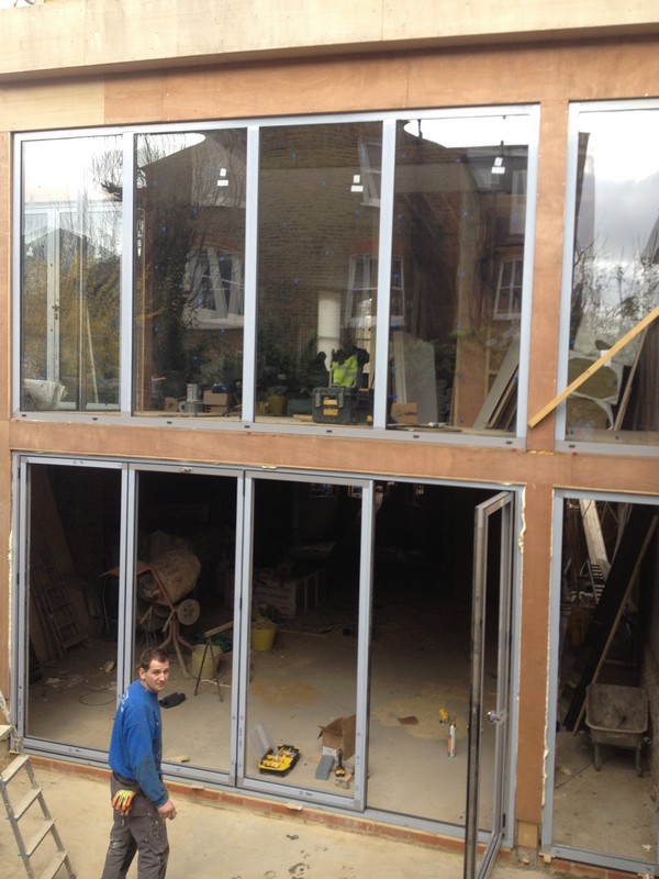 Aluminium bi-fold doors with two-storey glazing in Chingford