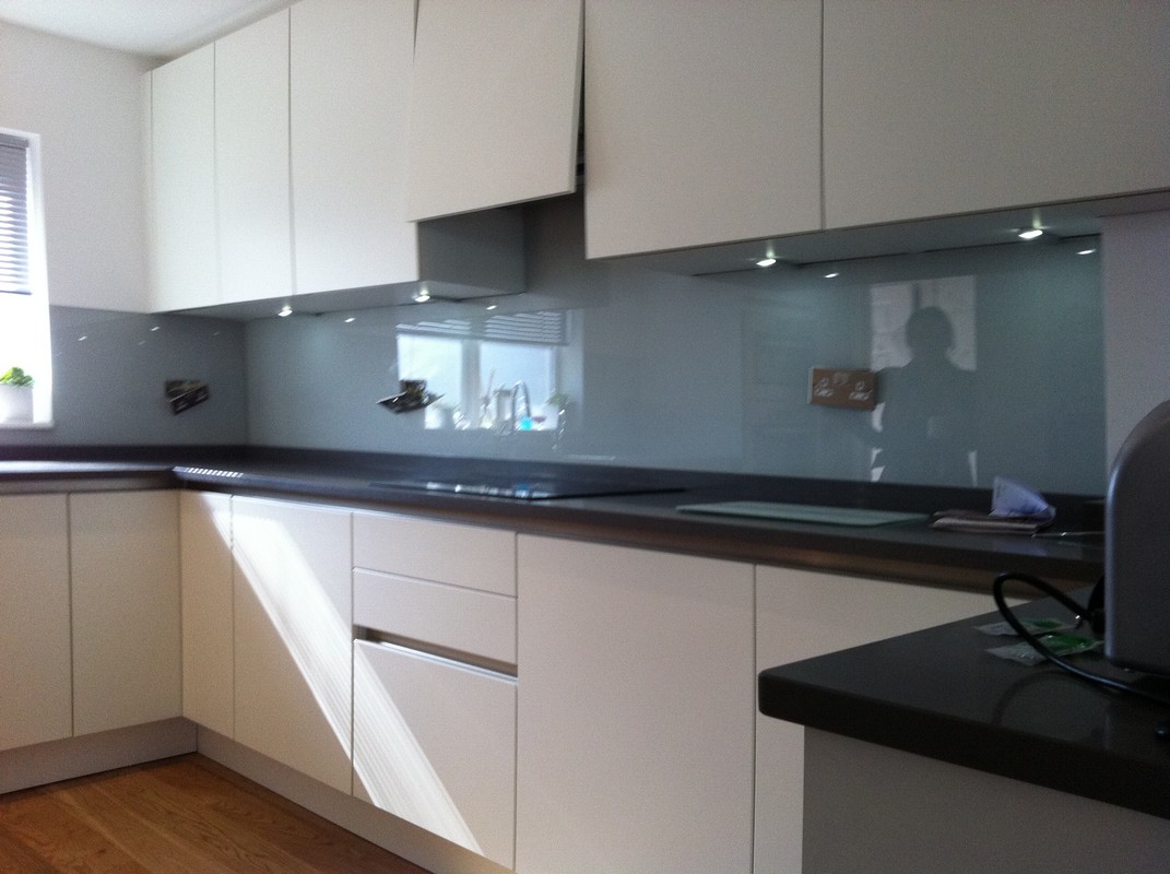 Grey glass kitchen splashback with LED lighting in Chingford