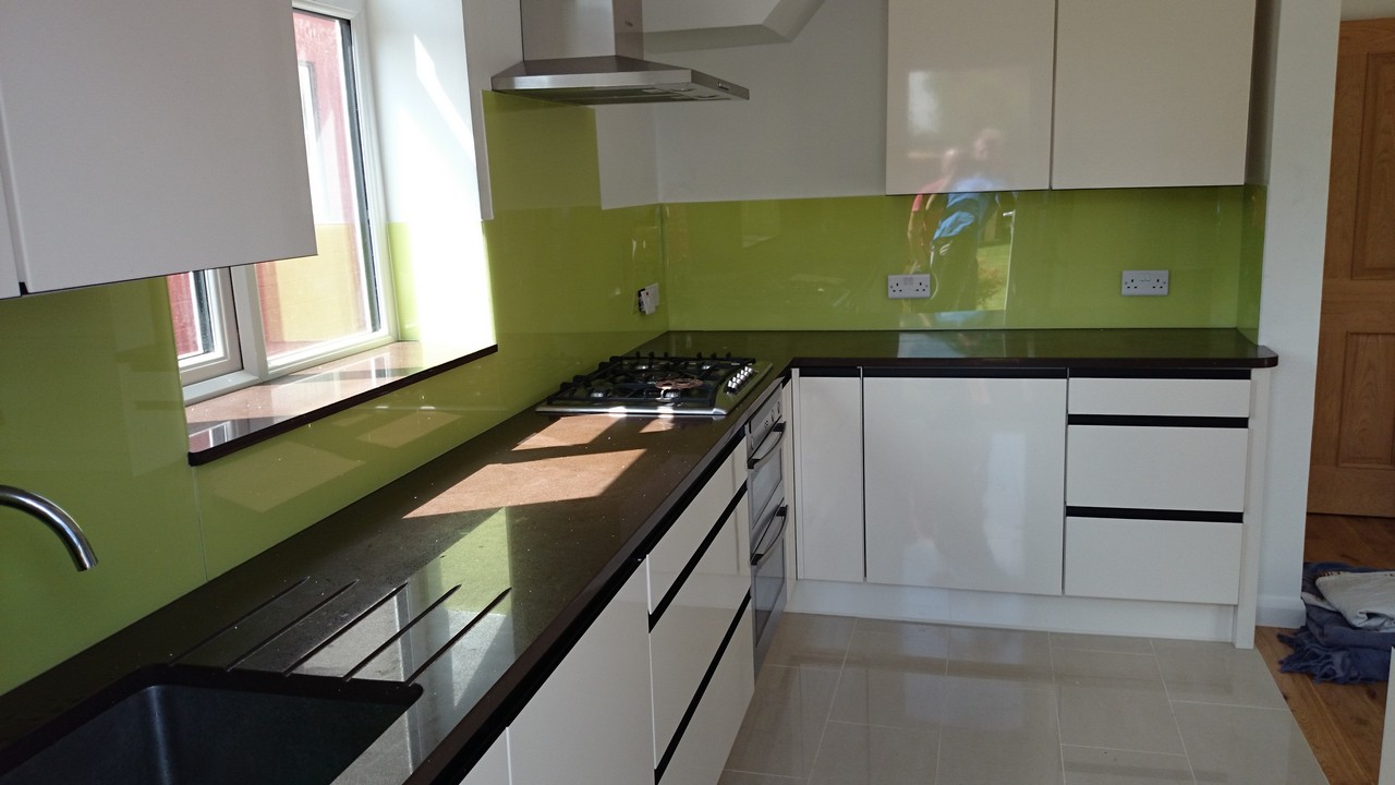 Lime green glass kitchen splashback installed by Chingford glaziers