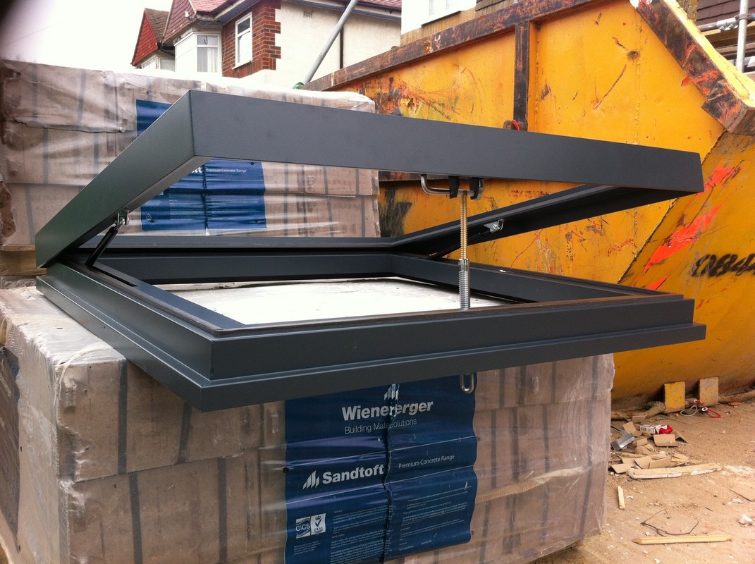 Opening flat roof skylight in anthracite grey installed in Chingford
